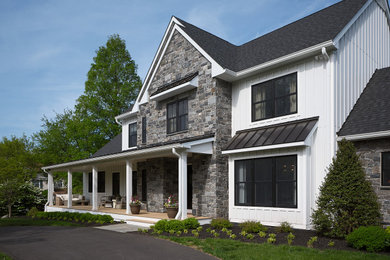 Example of a farmhouse exterior home design in Philadelphia