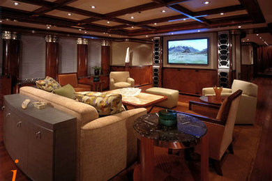 Large tuscan enclosed home theater photo in Seattle with a media wall