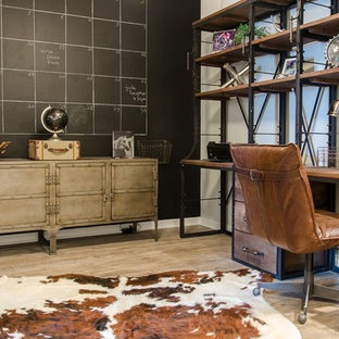 Inspiration for a mid-sized industrial home office in Miami with grey walls, vinyl floors and a freestanding desk.