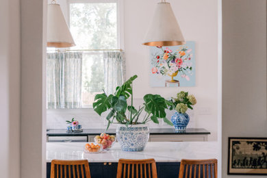 Eat-in kitchen - mid-sized eclectic l-shaped brown floor eat-in kitchen idea in Atlanta with beaded inset cabinets, blue cabinets, white backsplash, stainless steel appliances, an island and white countertops