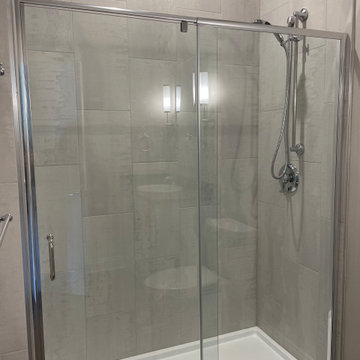 Beautiful Shower done with 12x24 porcelain tiles installed vertically.