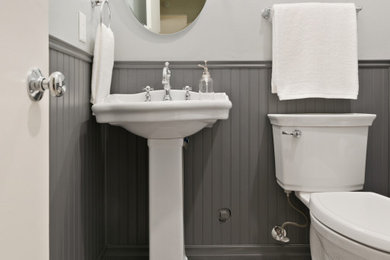 Inspiration for a small timeless porcelain tile, multicolored floor, single-sink and wainscoting bathroom remodel in San Diego with gray walls