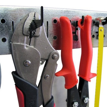 Wall Control metal pegboard strips can hold a wide range of tools in an otherwis