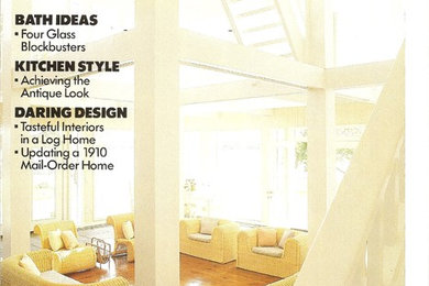 Example of a large ornate loft-style light wood floor family room design in Other with white walls, a standard fireplace and a wall-mounted tv
