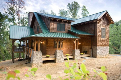 Example of a small mountain style two-story wood exterior home design in Charlotte
