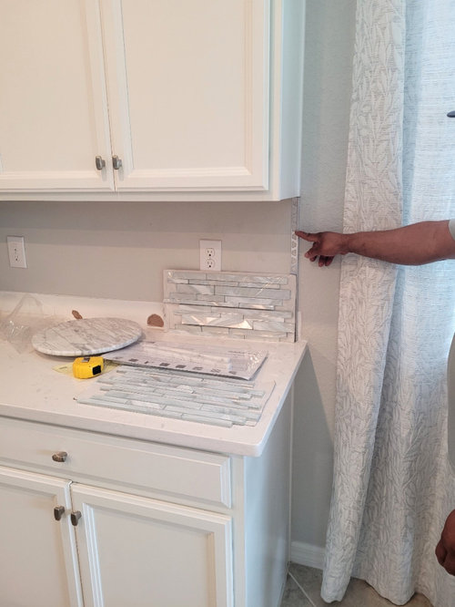 Should you tile exactly where My countertop extends 1 1/2