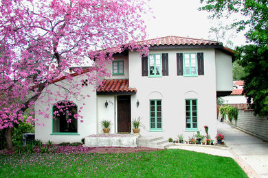 Photo of a large mediterranean two-storey stucco white exterior in Los Angeles.