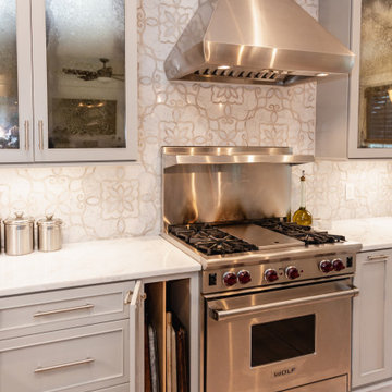 Vertical storage for trays and pans near the range.