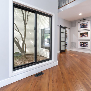 Black Window in Spacious Hallway - Renewal by Andersen Long Island, Queens & Bro