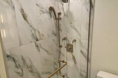 Inspiration for a mid-sized contemporary white tile and ceramic tile ceramic tile, white floor, single-sink and vaulted ceiling corner shower remodel in Chicago with beaded inset cabinets, brown cabinets, a two-piece toilet, white walls, an undermount sink, marble countertops, a hinged shower door, green countertops and a freestanding vanity