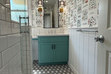 Inspiration for a timeless marble floor, single-sink and wainscoting bathroom remodel in Los Angeles with shaker cabinets, green cabinets, quartz countertops, white countertops and a built-in vanity
