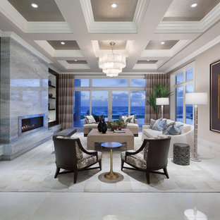 Idéer för att renovera ett mycket stort funkis allrum med öppen planlösning, med ett finrum, beige väggar, en bred öppen spis och en spiselkrans i metall