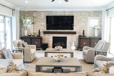 Design ideas for a transitional living room in Los Angeles with carpet, a standard fireplace and a stone fireplace surround.