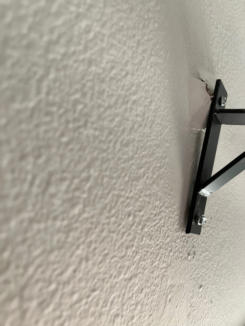 How to fix curtain rod anchor that was ripped out