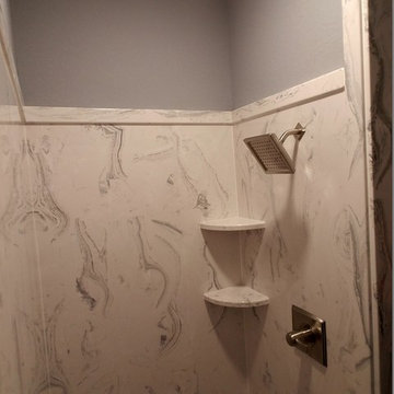 Beautiful cultured marble walk-in shower in master.