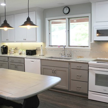 White Upper Cabinet and Gray Base Cabinet Kitchen With Quartz Counters