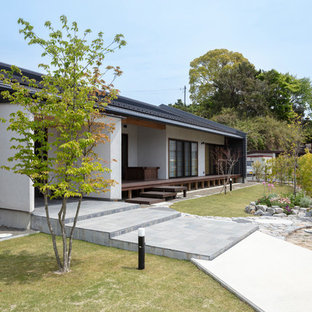 他の地域のアジアンスタイルのおしゃれな庭 (日向、コンクリート敷き 、私道) の写真