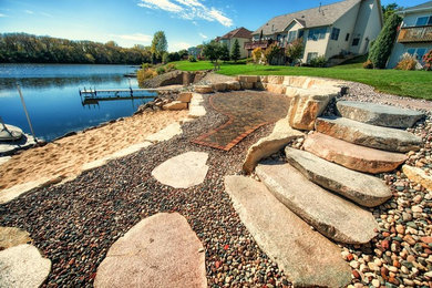 Large arts and crafts backyard gravel patio photo in Other with no cover