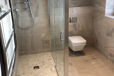Design ideas for a contemporary bathroom in Cheshire with beige tile, porcelain tile, beige walls, porcelain floors and beige floor.