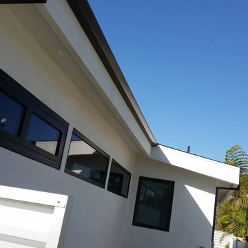 Costa Mesa, New Modern Home. Angle Face 5 inch Gutters, Smooth Downspouts.