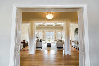 Photo of a mid-sized transitional formal enclosed living room in Baltimore with beige walls, medium hardwood floors, no fireplace and brown floor.