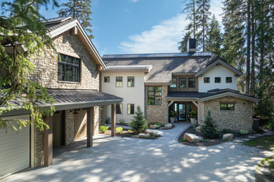 Example of a transitional two-story exterior home design in Boise