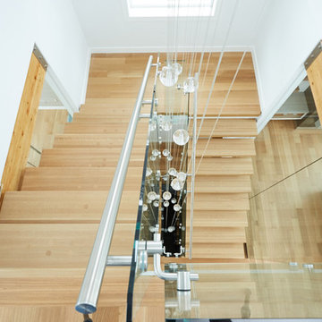 white oak mono stringer with stainless steel hand rail