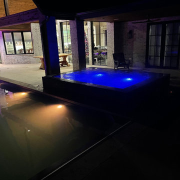Polymer vinyl liner pool w/concrete spillover spa & automatic pool cover