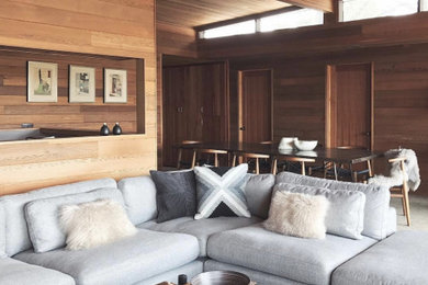 Mid-sized transitional open concept carpeted and beige floor living room photo in Portland with brown walls