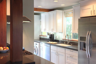 Trendy kitchen photo in San Francisco with an undermount sink, recessed-panel cabinets, white cabinets, quartz countertops and stainless steel appliances