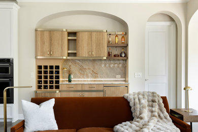 Mid-sized trendy single-wall dry bar photo in Minneapolis with no sink, light wood cabinets, quartzite countertops, beige backsplash and beige countertops