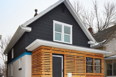 Inspiration for a mid-sized contemporary two-storey multi-coloured house exterior in Kansas City with mixed siding, a gable roof and a shingle roof.