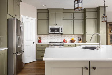 Kitchen - mid-sized french country l-shaped kitchen idea in Boise with shaker cabinets, an island and white countertops
