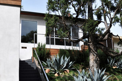 Inspiration for a mid-sized white one-story wood exterior home remodel in Phoenix