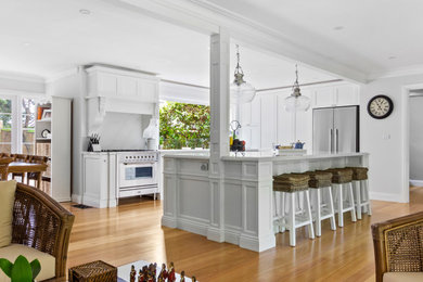 This is an example of a large traditional kitchen in Sydney with with island.