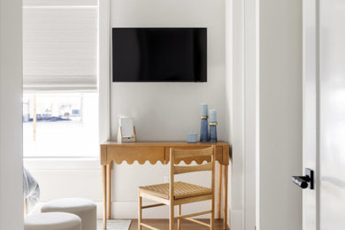Study room - freestanding desk dark wood floor and brown floor study room idea in Tampa with white walls