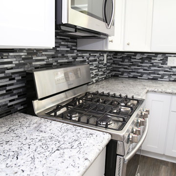 Kitchen Remodel with White Shaker Style Cabinets and Granite