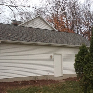 Landmark TL HD colonial slate. Siding removed from dormers and chimney chase. Th