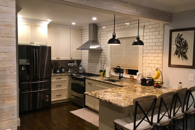 This is an example of a small contemporary kitchen in Boston.