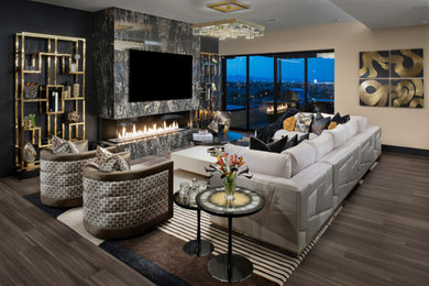 Living room - modern vinyl floor and brown floor living room idea in Las Vegas with beige walls, a standard fireplace and a stone fireplace