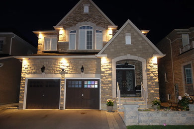 Inspiration for a transitional exterior home remodel in Toronto