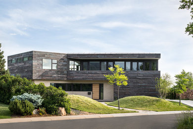 Large industrial brown two-story exterior home idea in Denver