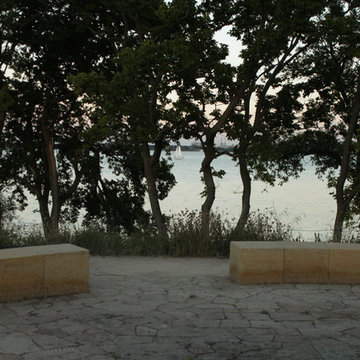 Curving Limestone Walls with Flagstone Pavement