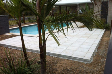 Photo of a mid-sized contemporary aboveground pool in Brisbane.