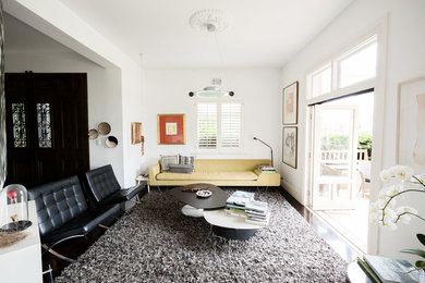 Inspiration for a mid-sized contemporary open concept living room in Sydney with white walls.
