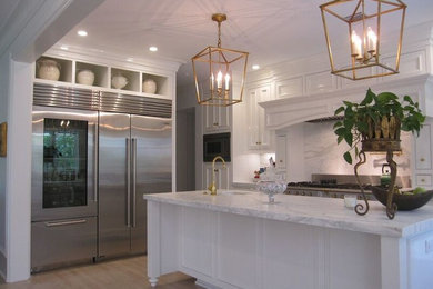 Example of a large classic light wood floor open concept kitchen design in Houston with a farmhouse sink, marble countertops, white backsplash, stone slab backsplash, stainless steel appliances and an island