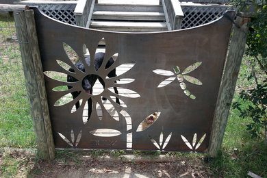 This is an example of a small rustic front porch design in Phoenix with decking.