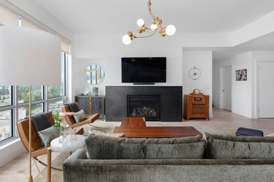 Living room - large modern formal and open concept light wood floor and brown floor living room idea in Seattle with white walls, a standard fireplace, a metal fireplace and a wall-mounted tv