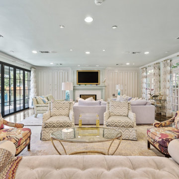 Spacious and Elegant Living Room with Floor-to-Ceiling Windows and Vibrant Patte