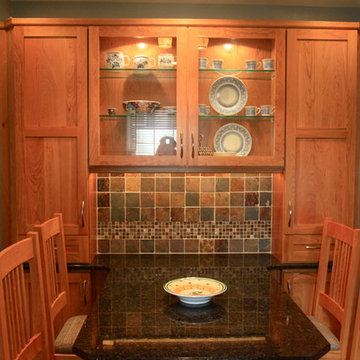 Cohesive Transitional Kitchen | Cherry Cabinets & Black Granite Table